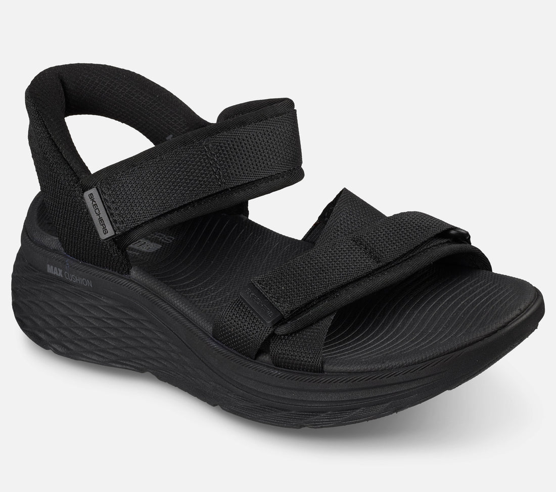 Skechers Slip Ins Max Cushioning Elite 2.0 Sandal Zoe on naisten sandaali, jossa yhdistyvät erittäin pehmeä Max Cushioning mukavuus, helppo pukeminen ja jalkaterää tukeva rakenne. Tämä Skechers sandaali on suunniteltu erityisesti kesäiseen kävelyyn, vapaa aikaan ja jokapäiväiseen käyttöön, kun kengältä halutaan keveyttä ja tehokasta vaimennusta.