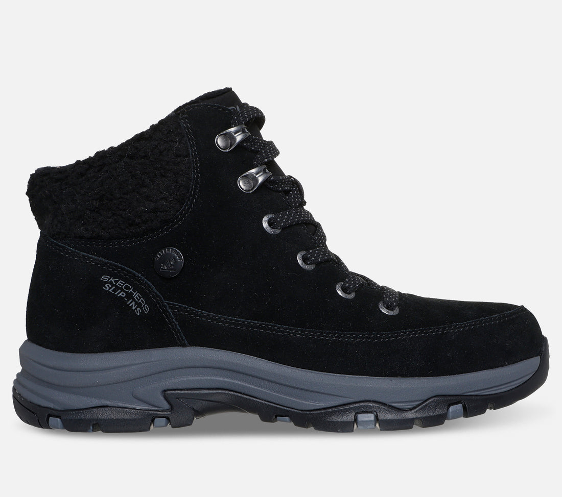 Skechers Hands Free Slip-ins Trego Snow Breeze Waterproof on naisten vedenpitävä talvikenkä, jossa yhdistyvät helppo jalkaan pukeminen, lämmin vuori ja tilava istuvuus. Musta mokkanahkapäällinen, pehmeä tekoturkiskaulus ja rennon sporttinen ulkonäkö tekevät kengästä käytännöllisen valinnan talven arkeen ja ulkoiluun.