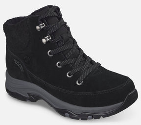 Skechers Hands Free Slip-ins Trego Snow Breeze Waterproof on naisten vedenpitävä talvikenkä, jossa yhdistyvät helppo jalkaan pukeminen, lämmin vuori ja tilava istuvuus. Musta mokkanahkapäällinen, pehmeä tekoturkiskaulus ja rennon sporttinen ulkonäkö tekevät kengästä käytännöllisen valinnan talven arkeen ja ulkoiluun.