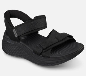 Skechers Slip Ins Max Cushioning Elite 2.0 Sandal Zoe on naisten sandaali, jossa yhdistyvät erittäin pehmeä Max Cushioning mukavuus, helppo pukeminen ja jalkaterää tukeva rakenne. Tämä Skechers sandaali on suunniteltu erityisesti kesäiseen kävelyyn, vapaa aikaan ja jokapäiväiseen käyttöön, kun kengältä halutaan keveyttä ja tehokasta vaimennusta.