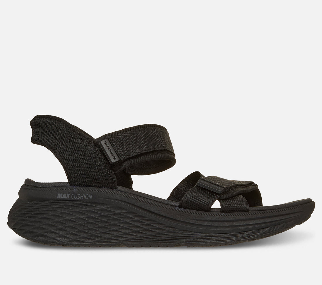 Skechers Slip Ins Max Cushioning Elite 2.0 Sandal Zoe on naisten sandaali, jossa yhdistyvät erittäin pehmeä Max Cushioning mukavuus, helppo pukeminen ja jalkaterää tukeva rakenne. Tämä Skechers sandaali on suunniteltu erityisesti kesäiseen kävelyyn, vapaa aikaan ja jokapäiväiseen käyttöön, kun kengältä halutaan keveyttä ja tehokasta vaimennusta.